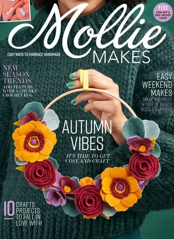 The front cover of a Mollie Makes magazine issue showing a flower wreath