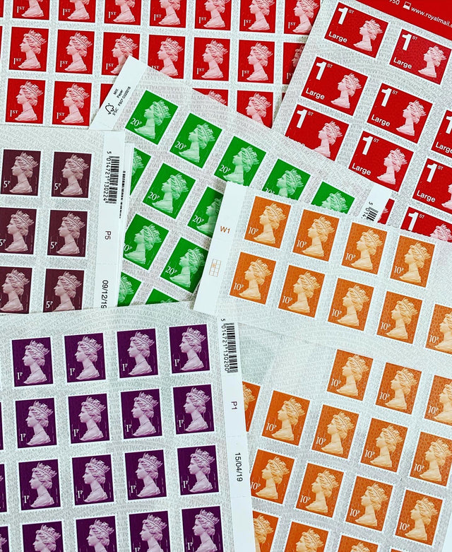 A selection of postage stamps sheets with different postage values